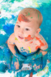 Kleiner Junge spielt mit Fingerfarbe