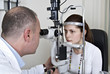Male ophthalmologist conducting an eye examination