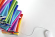 Computer mouse plugged into stack of rainbow-colored books