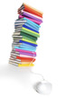 Photo: Mouse connected to multi-colored book stack Mouse connected to multi-colored book stack
