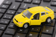 Photo: Computer keyboard and toy car Computer keyboard and toy car