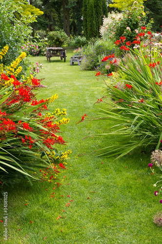 Photo: Garden path and old wagon Garden path and old wagon
