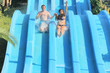 man and woman on the slide