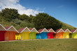 Foto: Row of beach huts on bright summer day Row of beach huts on bright summer day