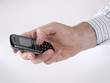 Businessman hand with cellphone aka mobile phone Businessman hand with cellphone aka mobile phone