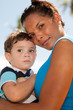 Pretty hispanic woman with baby boy