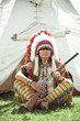 Photo: North American Indian in full dress. Reconstruction North American Indian in full dress. Reconstruction
