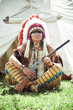Photo: North American Indian in full dress. Reconstruction North American Indian in full dress. Reconstruction