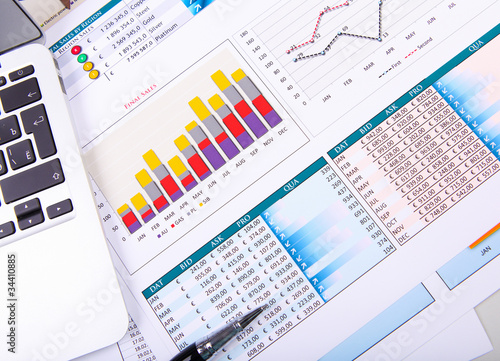 Photo: Graphs, charts, business table. Graphs, charts, business table.