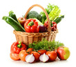 Vegetables in wicker basket isolated on white Vegetables in wicker basket isolated on white