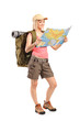 Female hiker looking at map