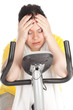tired fat woman on stationary fitness bicycle, series