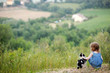 Adorable little girl and a cat outdoors