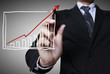 Male hand drawing a graph