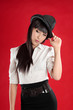 Woman wearing a hat and  tilting head
