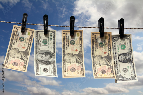 Photo: paper dollars are drying on rope paper dollars are drying on rope
