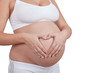 Pregnant woman hold hands on a belly like heart
