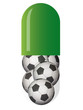 green capsule with soccer balls