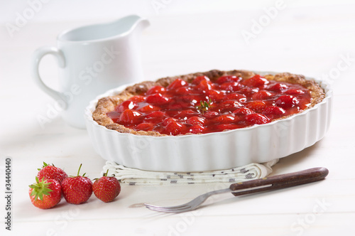 Photo: sweet strawberry pie on a white table sweet strawberry pie on a white table