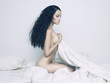Nude elegant woman in bed