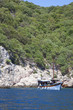 classic boat anchored in open sea