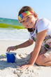 Child playing in the sand