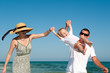Family having fan at the beach