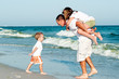 Family having fan at the beach