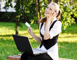 Beautiful Woman with Credit Card Using Her Laptop.