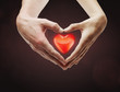 Heart shape  made of  female and male hands together
