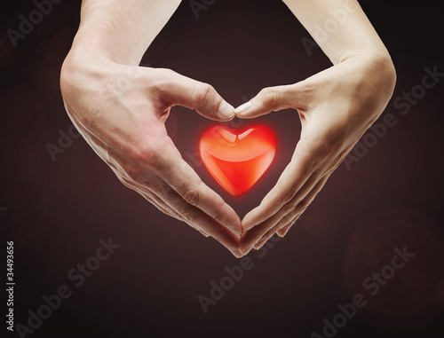 Photo: Heart shape made of female and male hands together Heart shape made of female and male hands together