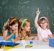 boring  student with clever children girl raising hand