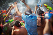 Photo: young people shooting and throwing water at each other young people shooting and throwing water at each other