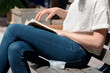 Woman Reading Book on Park Bench Woman Reading Book on Park Bench