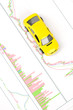 Toy car and financial graph Toy car and financial graph