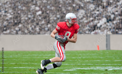Photo: Football Player running with the ball Football Player running with the ball