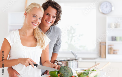 Photo: Beautiful couple cooking Beautiful couple cooking