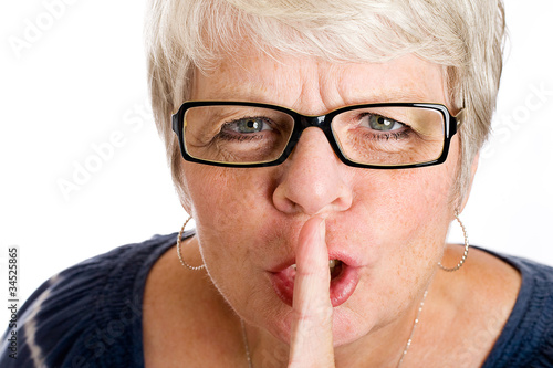 Photo: Mature woman shushing Mature woman shushing