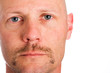 Serious man with a mustache