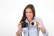 Young woman comparing digital compact and reflex cameras