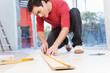 Architect measuring the plank