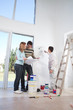 Young couple looking at blueprint