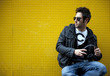 Man against a yellow wall in modern style