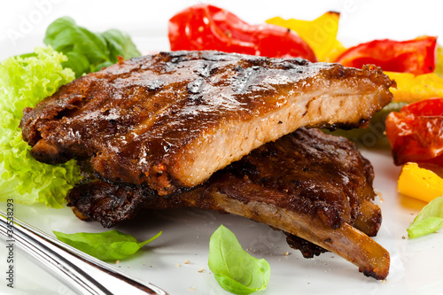 Photo: Tasty grilled ribs with vegetables Tasty grilled ribs with vegetables