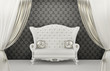 Luxurious Sofa with pillows before wall ornament. Armrest Luxurious Sofa with pillows before wall ornament. Armrest
