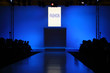 podium before showing new collection of clothing