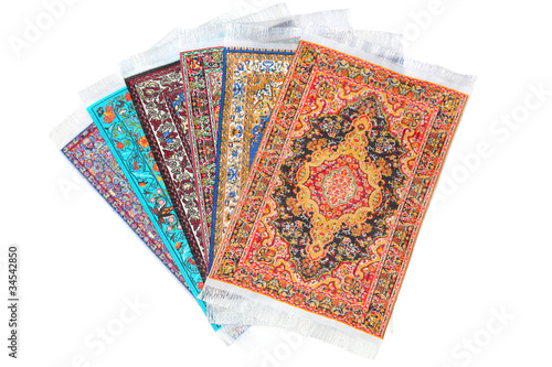 Photo: Six rectangular carpets lie in form fan on white Six rectangular carpets lie in form fan on white