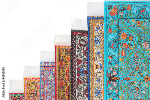 Photo: Seven varicoloured carpets lie stairs on growth on each other Seven varicoloured carpets lie stairs on growth on each other