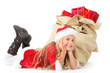 miss santa lying beside christmas sack smiling
