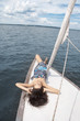 gril with closed eyes on yacht
